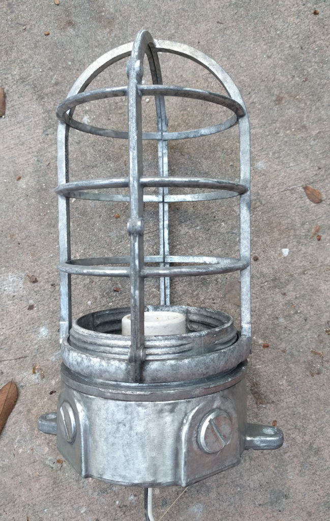 part of a metal light fixture after cleaning