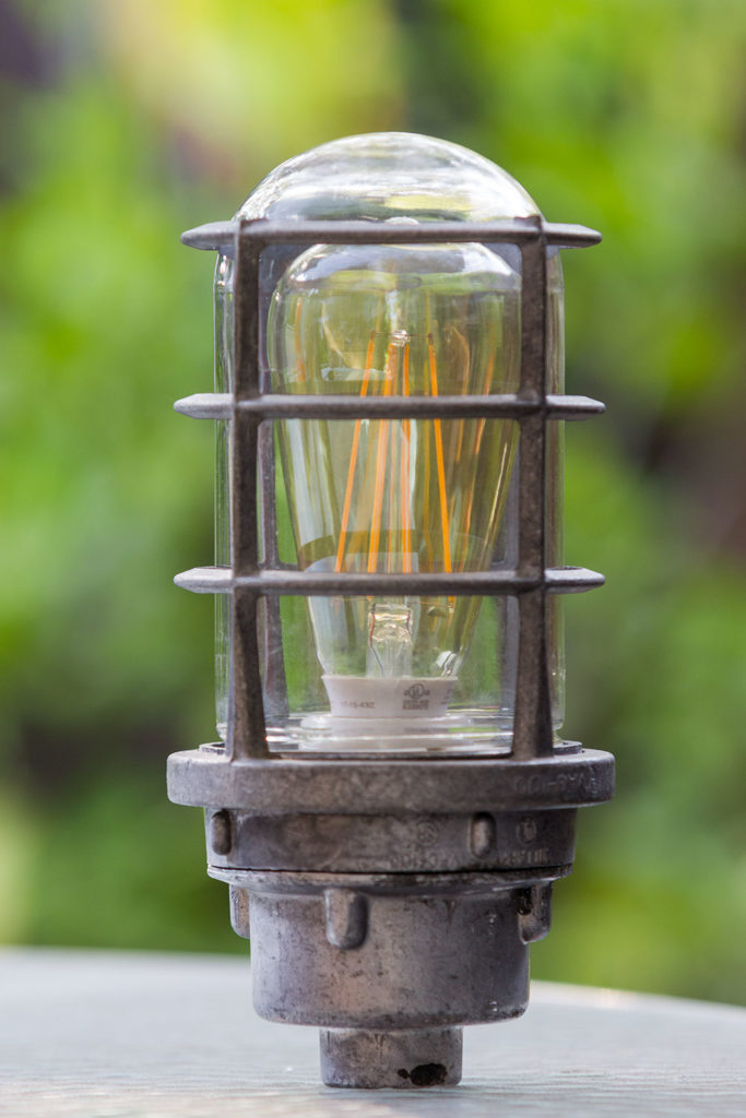 outdoor light fixture converted into a lamp, with LED filament light bulb inside