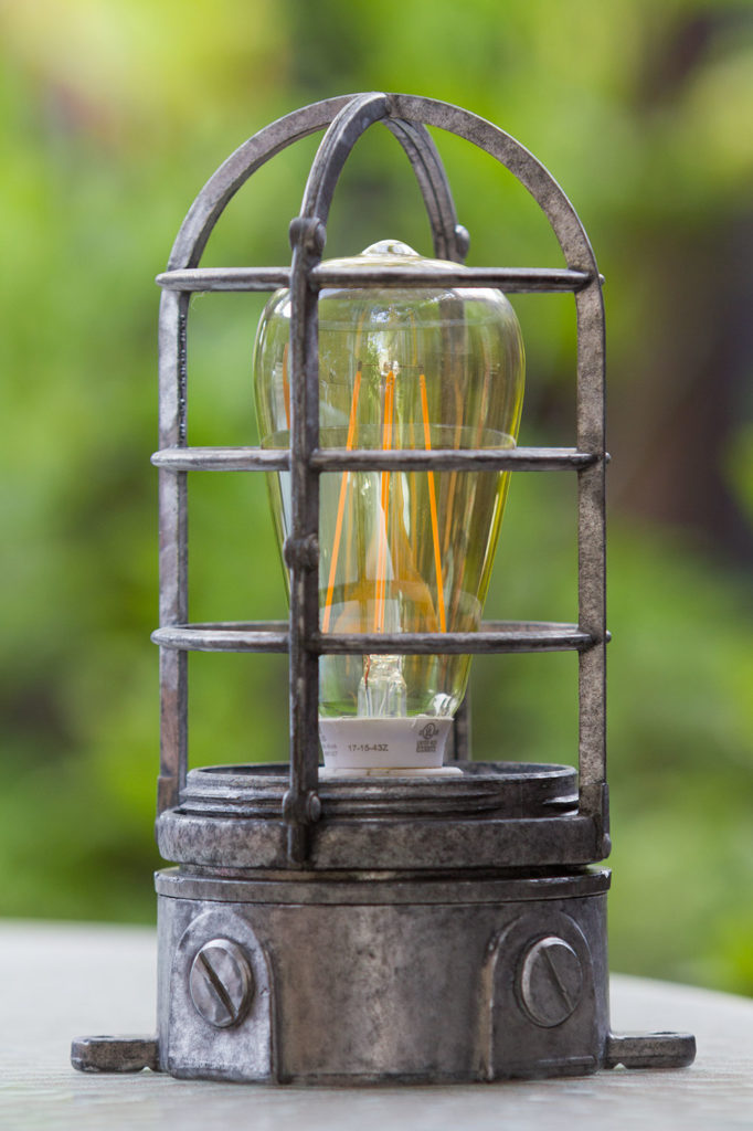 outdoor light fixture converted into a lamp, with LED filament light bulb inside